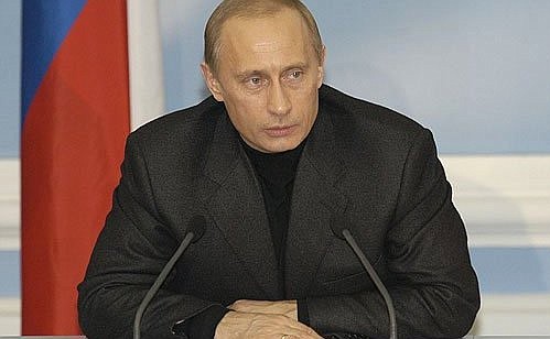 President Putin answering journalists\' questions at his campaign headquarters.