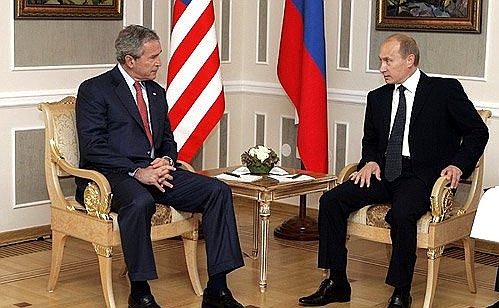 With U.S. President George W. Bush.