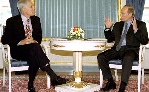 Vladimir Putin with Ted Turner.
