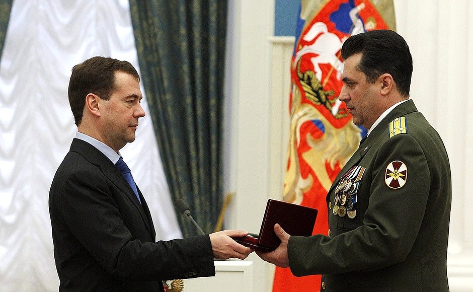 Presenting state decorations. Colonel Alexander Okunev received the title Merited Military Pilot of the Russian Federation.