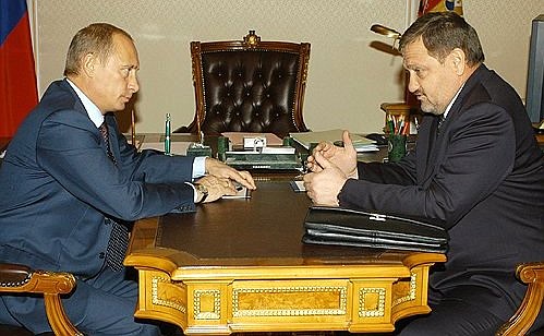 Vladimir Putin meeting with Chechen President Akhmat Kadyrov.