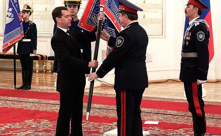 Presenting banners to Cossack military societies. Dmitry Medvedev presents the banner of Don Cossack military society to ataman Viktor Vodolatsky.