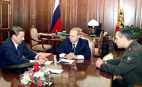 President Putin with Defence Minister Sergei Ivanov (left) and General Staff Chief Anatoly Kvashnin.