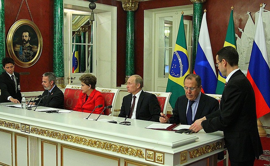 Signing joint Russian-Brazilian documents.