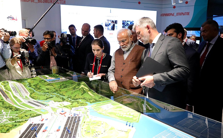 Prime Minister of India Narendra Modi and Minister of Transport Yevgeny Ditrikh, right, during a tour of the Far East Street exhibition.