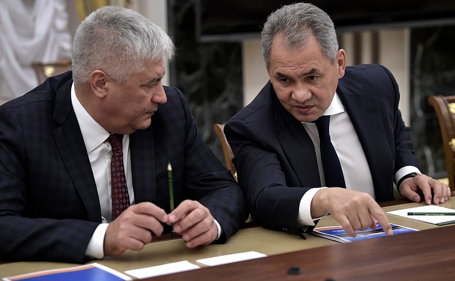 Before the meeting with permanent members of the Security Council. Interior Minister Vladimir Kolokoltsev (left) and Defence Minister Sergei Shoigu.