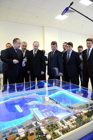 Visiting the Sochi Media Centre. Inspecting a scale model of the sea and cruise passenger termin.
