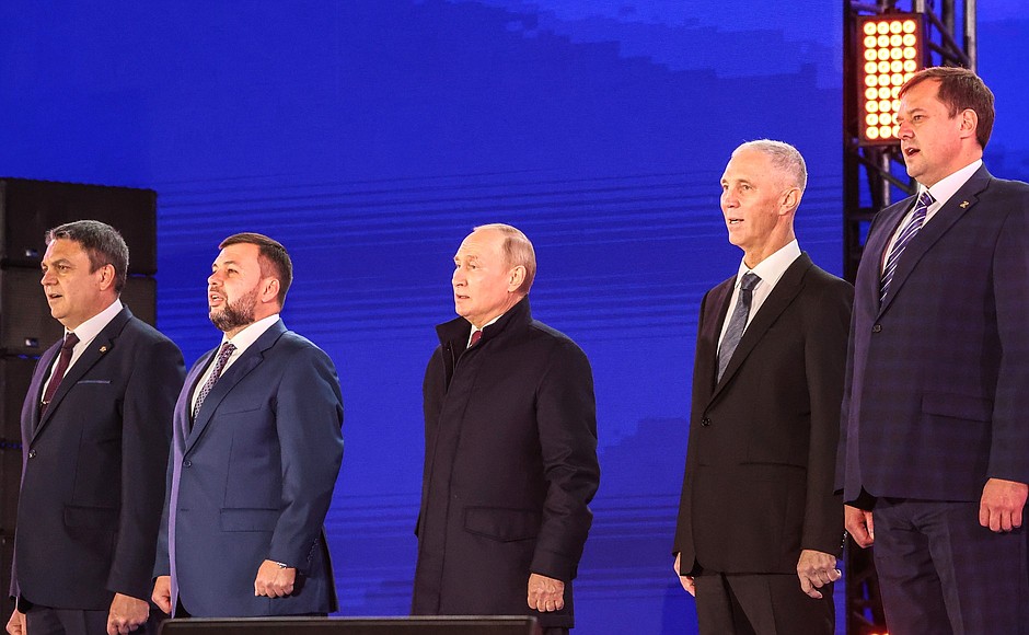 Head of the Lugansk People's Republic Leonid Pasechnik, Head of the Donetsk People's Republic Denis Pushilin, Vladimir Putin, Head of the Kherson Region Vladimir Saldo and Head of the Zaporozhye Region Yevgeny Balitsky (left to right) during the performance of the Anthem of the Russian Federation at the concert rally People's Choice: Together Forever in support of the accession of the DPR, LPR, and the Zaporozhye and Kherson regions to Russia.