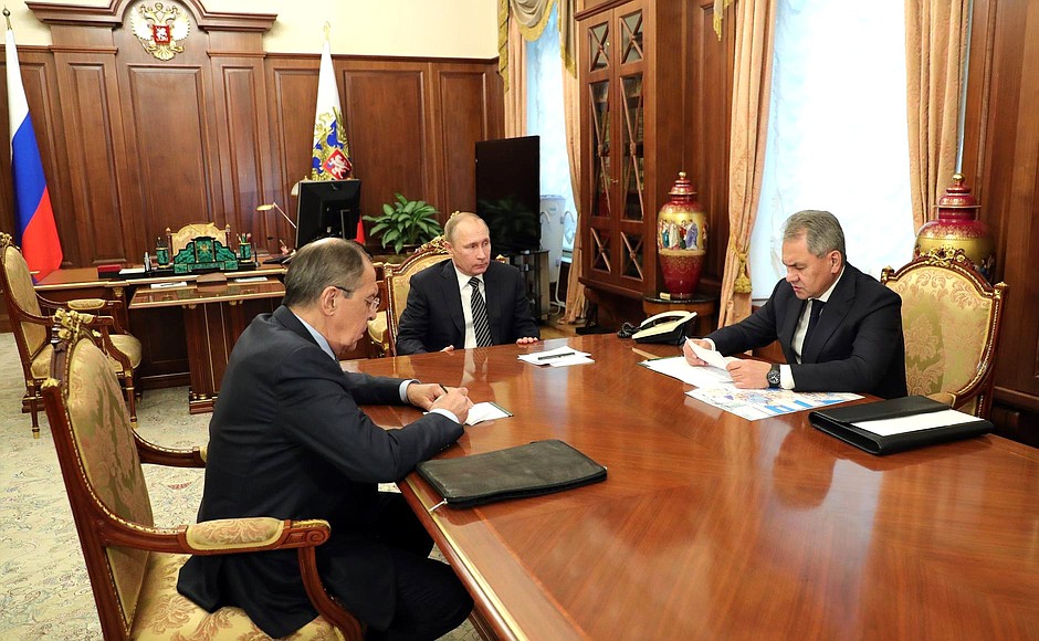 Meeting with Defence Minister Sergei Shoigu (right) and Foreign Minister Sergei Lavrov.