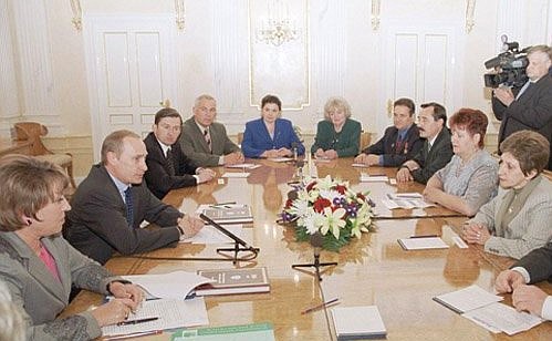 Vladimir Putin met with a group of social workers.