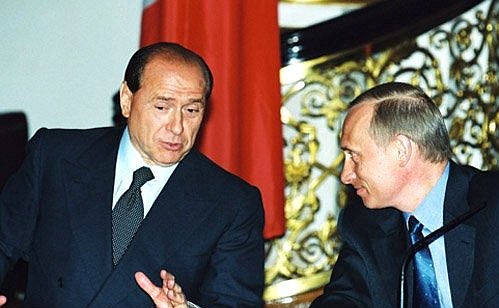 President Vladimir Putin and Italian Prime Minister Silvio Berlusconi during a joint news conference.