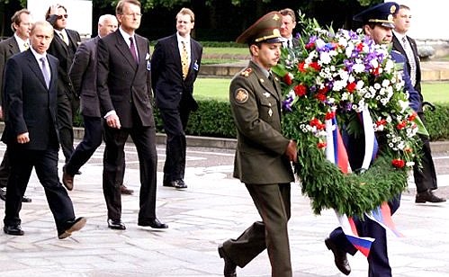 President Vladimir Putin laying a wreath to the monument to the Soviet liberator soldier in Treptow Park.