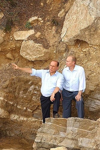 President Putin and Italian Prime Minister Silvio Berlusconi making a tour of the grounds of Villa Certosa.