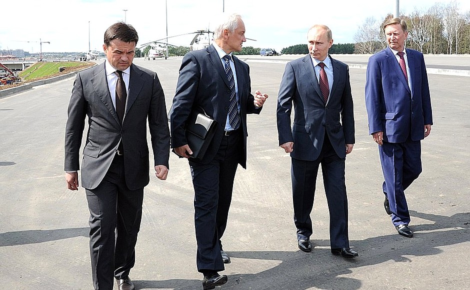 Inspecting work on the Odintsovo north bypass road in Moscow Region, which will link the Moscow Ring Road and the Moscow-Minsk M1 highway. From left to right: Chief of Staff of the Presidential Executive Office Sergei Ivanov, President of Russia Vladimir Putin, Presidential Aide Andrei Belousov, and Acting Governor of Moscow Region Andrei Vorobyov.