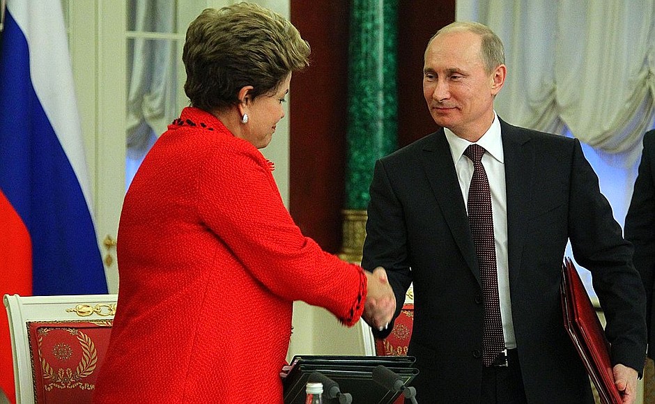 Signing joint Russian-Brazilian documents.