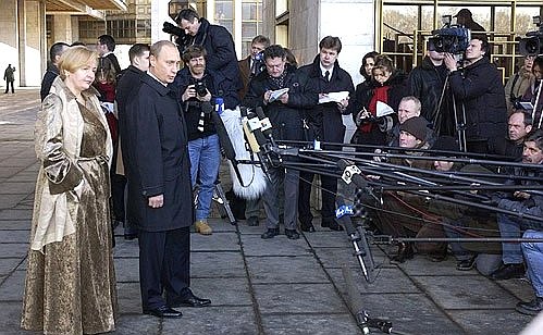 President Putin speaking with journalists after voting in the presidential election.