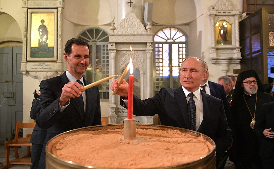 В православной церкви Святой Девы Марии. С Президентом Сирийской Арабской Республики Башаром Асадом.