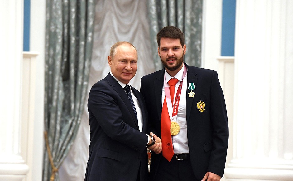 Presenting state decorations to winners of the 2020 Summer Paralympic Games in Tokyo. Kirill Smirnov, archery champion of the Paralympics, receives the Order of Friendship.