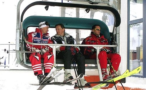 President Putin with Austrian Federal Chancellor Wolfgang Schuessel (centre) rising in a cable car at the ski resort of St Christoph.