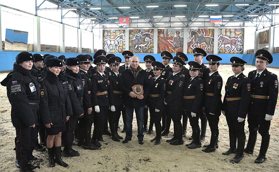 With officers of the 1st Operational Regiment of Moscow police. The officers gave the President a horseshoe for luck.