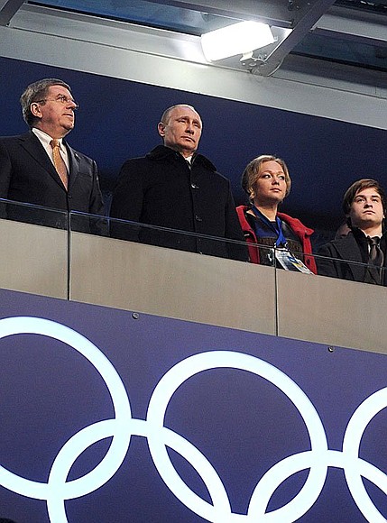 At the Opening Ceremony for the XXII Olympic Winter Games. With International Olympic Committee President Thomas Bach (left) and bobsleigh racer Irina Skvortsova.