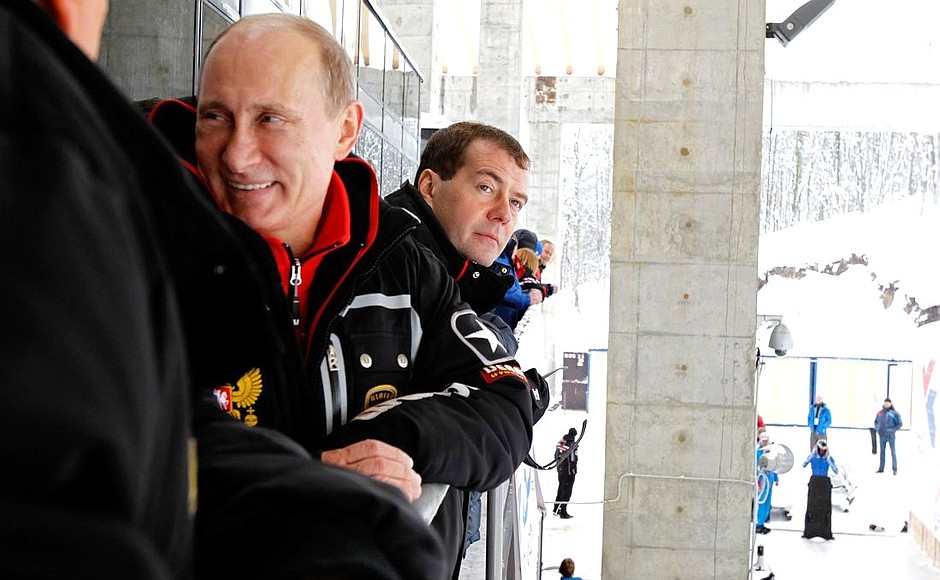 With Prime Minister Vladimir Putin while reviewing the sledding and bobsleigh track.