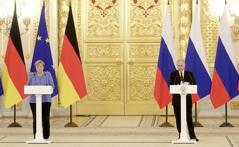 With Federal Chancellor of Germany Angela Merkel at a news conference following Russian-German talks.