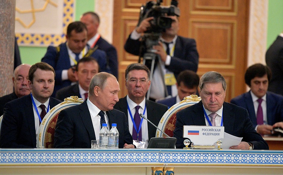 With Presidential Aide Yury Ushakov at the meeting of the CIS Heads of State Council in expanded format.