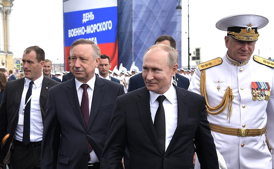 With Acting Governor of St Petersburg Alexander Beglov and Navy Commander-in-Chief Nikolai Yevmenov, right, after the Main Naval Parade.
