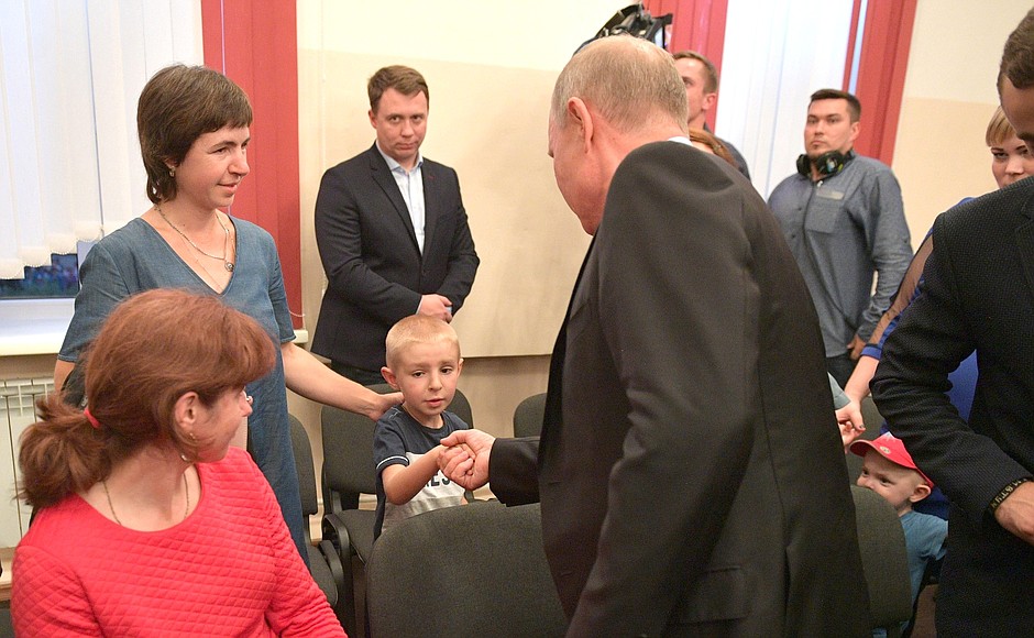 At a meeting with residents of the Irkutsk Region who took part in relief efforts following flash floods in the region, as well as with flood victims.
