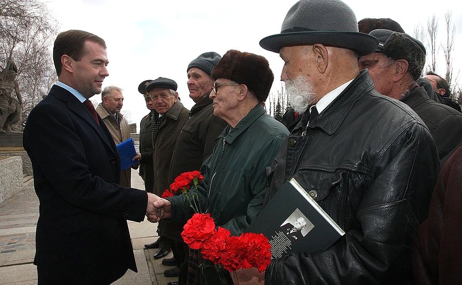 With World War II veterans who fought in the Battle of Stalingrad during a visit to the Mamayev Kurgan memorial complex.