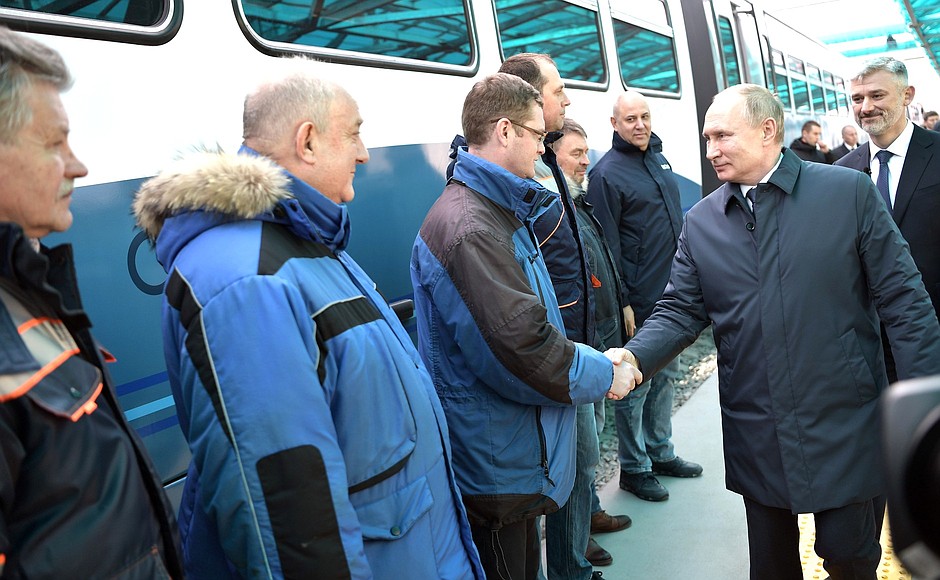 With builders before opening the Crimean Bridge to railway traffic.