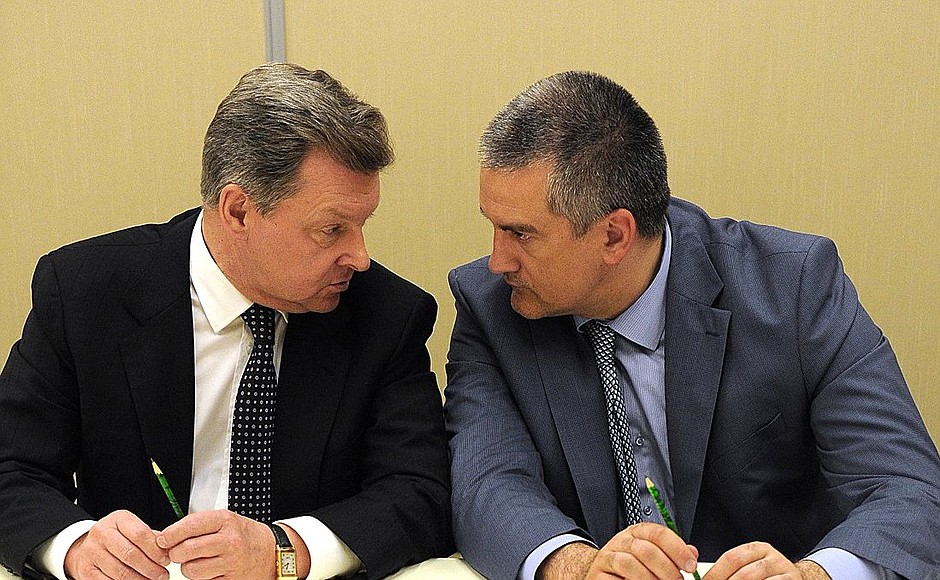 Before a meeting with members of the Crimean Tatar community. Presidential Plenipotentiary Envoy to the Crimean Federal District Oleg Belaventsev (left) and Acting Head of the Republic of Crimea Sergei Aksyonov.