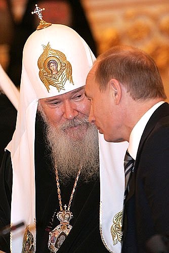 At a meeting with Russian Orthodox clergy to mark the ninetieth anniversary of the patriarchate\'s restoration. With Patriarch of Moscow and All Russia Alexii II.