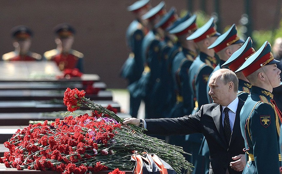 Laying flowers at the memorial sign established in honour of the Hero City Odessa by the Kremlin wall.