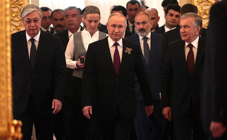 Before a working dinner with heads of foreign states who had arrived in Moscow for the celebration.
