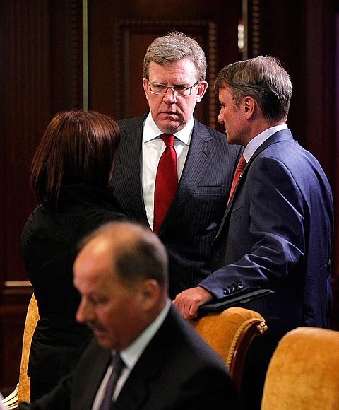 Vnesheconombank Chairman Vladimir Dmitriev (sitting), Economic Development Minister Elvira Nabiullina, Deputy Prime Minister and Finance Minister Alexei Kudrin, and Chairman of the Board and CEO of Sberbank of Russia Herman Gref (standing, right) prior to meeting on economic issues.
