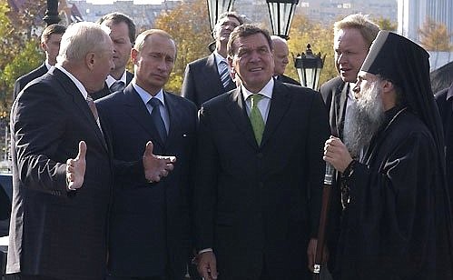 President Putin with German Chancellor Gerhard Schroeder and Sverdlovsk Region Governor Eduard Rossel at the entrance to the Church-on-the-Blood of All the Saints that Shone in the Russian Land.