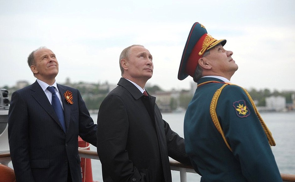 With Defence Minister Sergei Shoigu (left) and Federal Security Service Director Alexander Bortnikov.