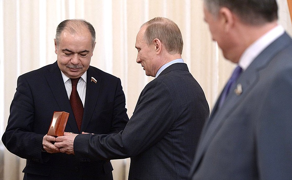 Before the meeting with senior members of the Federation Council, Vladimir Putin wished a happy birthday to Deputy Speaker of the Federation Council Ilyas Umakhanov and presented him with a watch.