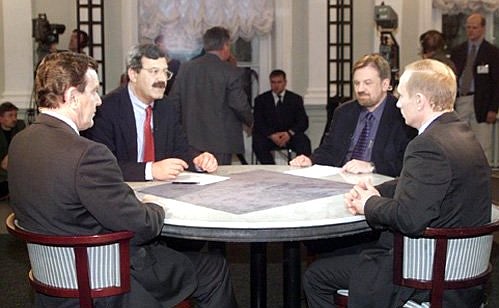 President Vladimir Putin and Chancellor Gerhard Schroeder giving an interview to Russian and German television.