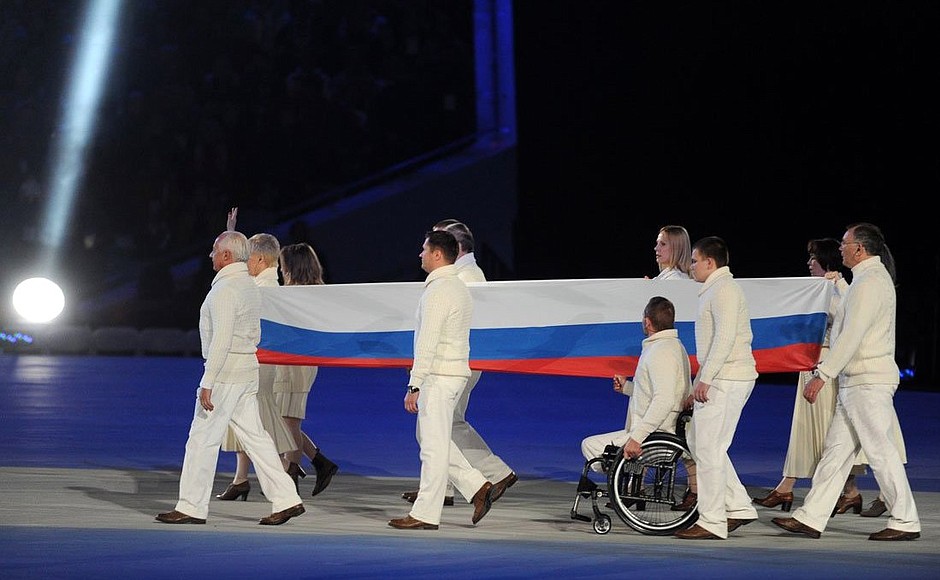 XI Paralympic Winter Games opening ceremony. Carrying the Paralympic flag.