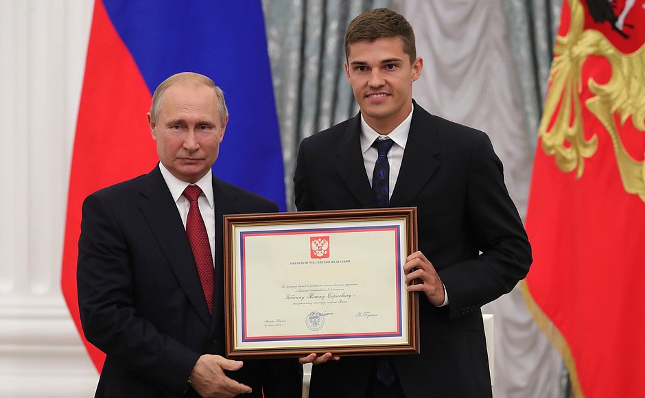 A letter of recognition for contribution to the development of Russia football and high athletic achievement is presented to Russia national football team player Roman Zobnin.