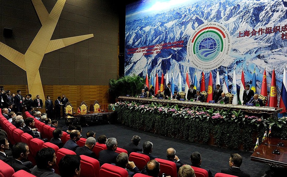 Signing documents following the summit of Shanghai Cooperation Organisation.