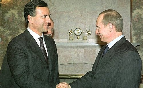 President Putin with Italian Foreign Minister Franco Frattini.