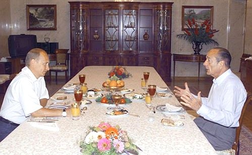 President Putin at a breakfast with French President Jacques Chirac.