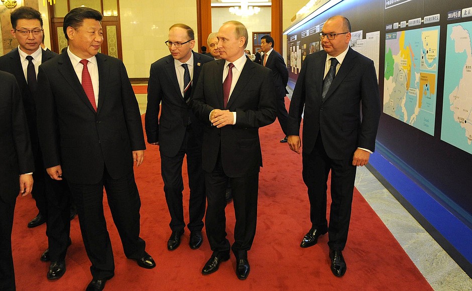 With President of China Xi Jinping at the exhibition during the opening ceremony of the Russian-Chinese media tour Russian-Chinese Border – Border of Peace and Cooperation.