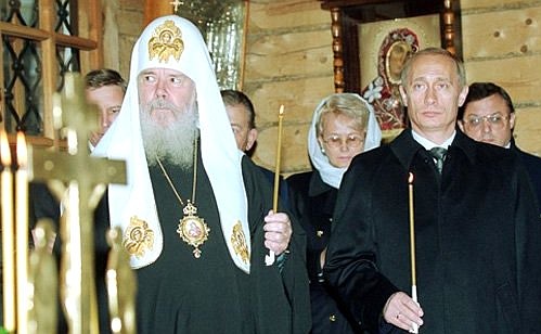 President Vladimir Putin in the Chapel of the Sovereign Icon of the Blessed Virgin near the Cathedral of Christ the Saviour in Moscow attending a memorial service for those killed in the crash of an Ilyushin-18 near Batumi on October 25.