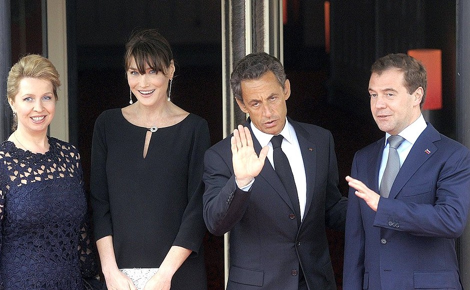 Svetlana Medvedeva, Carla Bruni, Nicolas Sarkozy, and Dmitry Medvedev before the working lunch at the G8 summit.