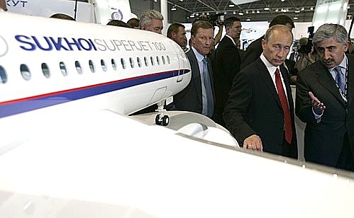M. GROMOV FLIGHT RESEARCH INSTITUTE, ZHUKOVSKY AIR BASE, MOSCOW REGION. 8th International Aviation and Space Salon MAKS-2007. At the Civil Aviation, Military Transport Aviation, International Cooperation and Components booth presented by the Russian Associated Aviation Construction Corporation. Near the stand of the Sukhoi Superjet 100. Chairman of the Corporation\'s management board Alexei Fedorov, Vice President of the Corporation and Sukhoi General Director Mikhail Pogosian giving explanations.